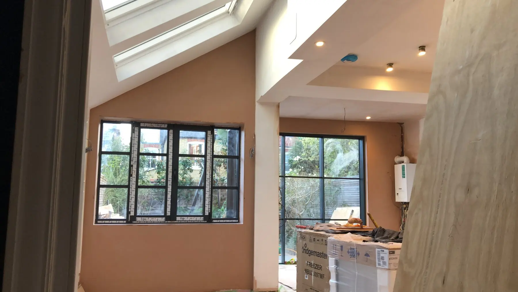 Fresh internal plaster wall in London house, newly skimmed and ready for decorating