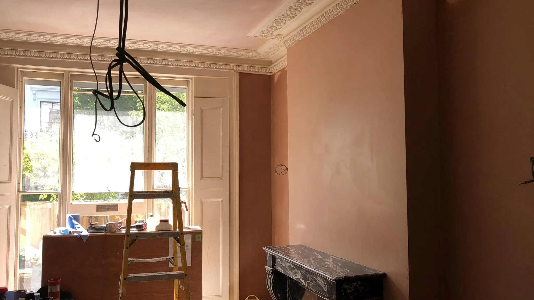 Wide view of finished vintage plaster wall in London room